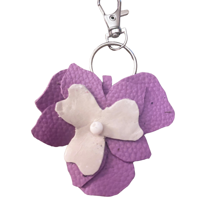 Purple and white layered leather flower keychain with silver tone ring and lobster clasp